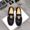 Versace black textured loafers with gold Medusa head and bar detail