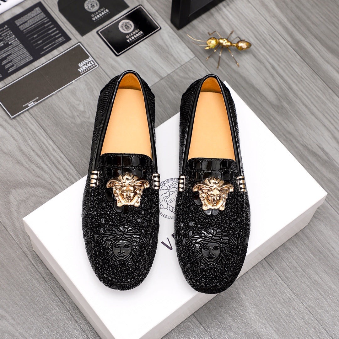 Versace black textured loafers with gold Medusa head and bar detail