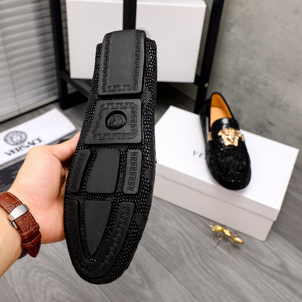 Versace black loafers with embossed Medusa heel panel and patterned trim