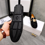Versace black loafers with embossed Medusa heel panel and patterned trim