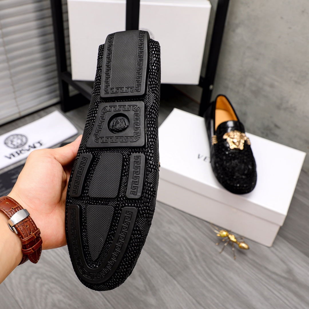 Versace black loafers with embossed Medusa heel panel and patterned trim