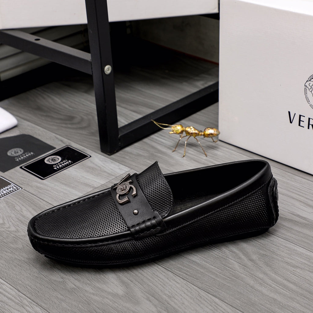 Versace black slip-on loafer with side buckle and pebbled textured upper