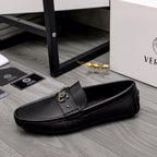 Versace black slip-on loafer with side buckle and pebbled textured upper