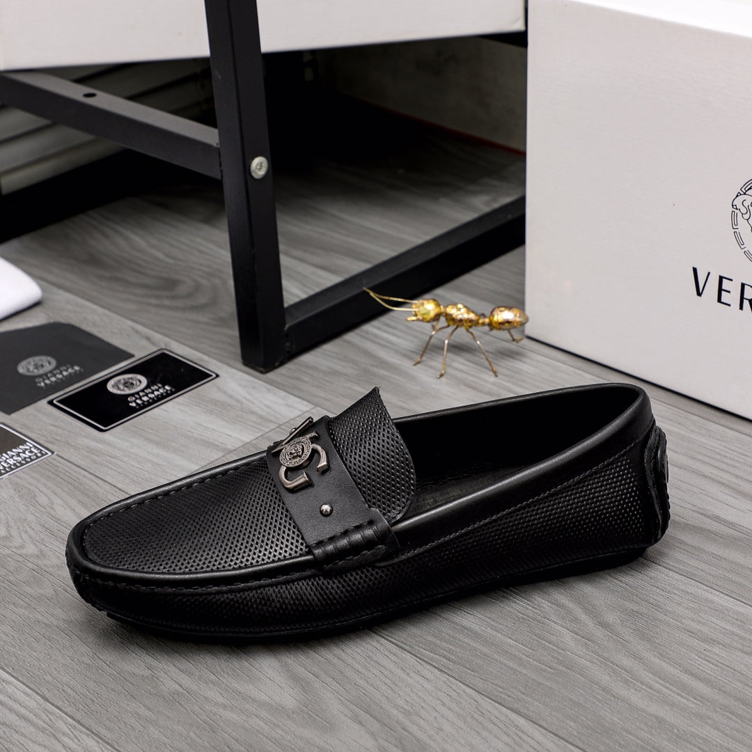 Versace black slip-on loafer with side buckle and pebbled textured upper