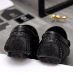 Versace black loafer heels with embossed Medusa logo and stitched detailing