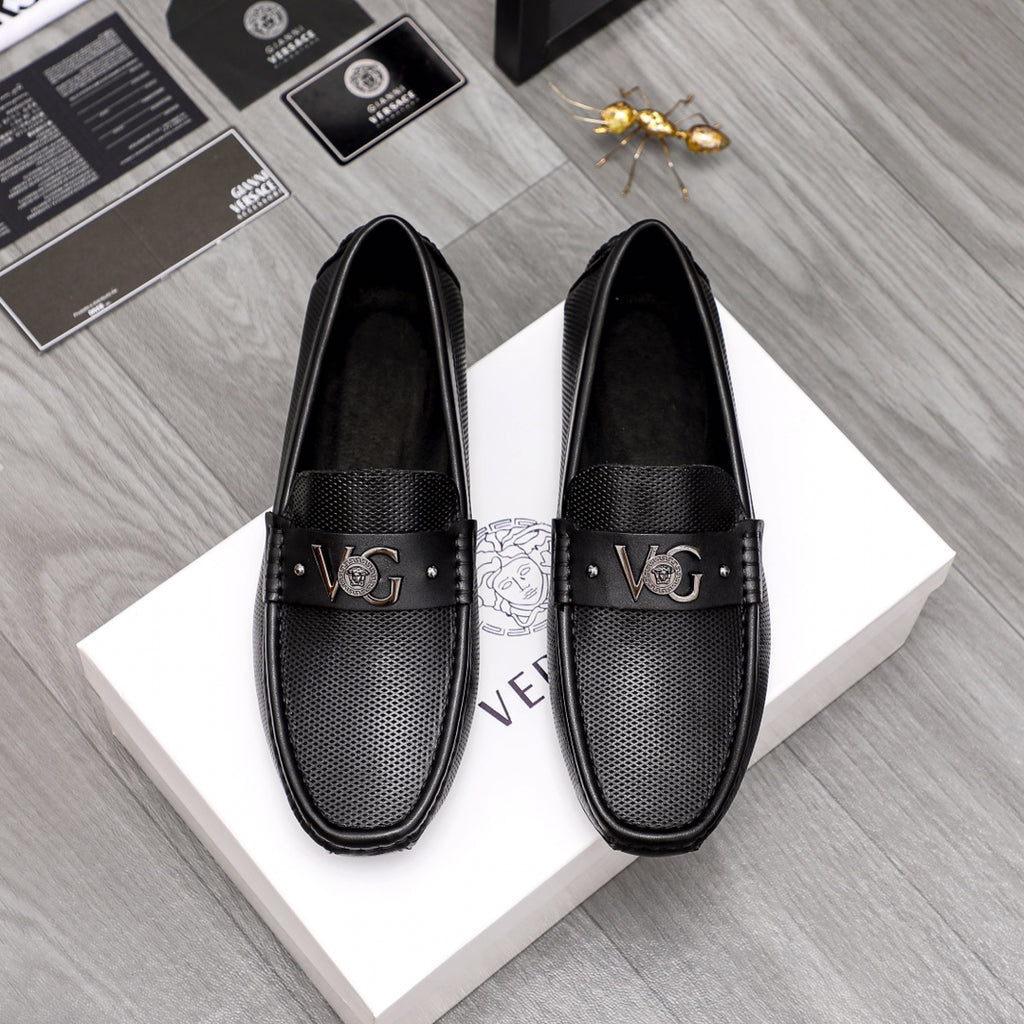 Versace black slip-on loafers with buckle and textured perforated vamp