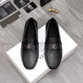 Versace black slip-on loafers with buckle and textured perforated vamp