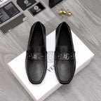 Versace black slip-on loafers with buckle and textured perforated vamp