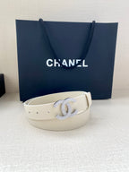 Chanel belt light cream leather with stud holes and rhinestone CC buckle, front view