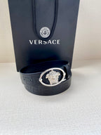 Versace belt with embossed dark navy strap and silver-tone oval buckle