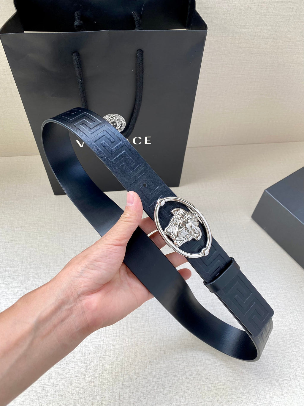 Versace belt with embossed dark navy strap and silver-tone oval Medusa buckle