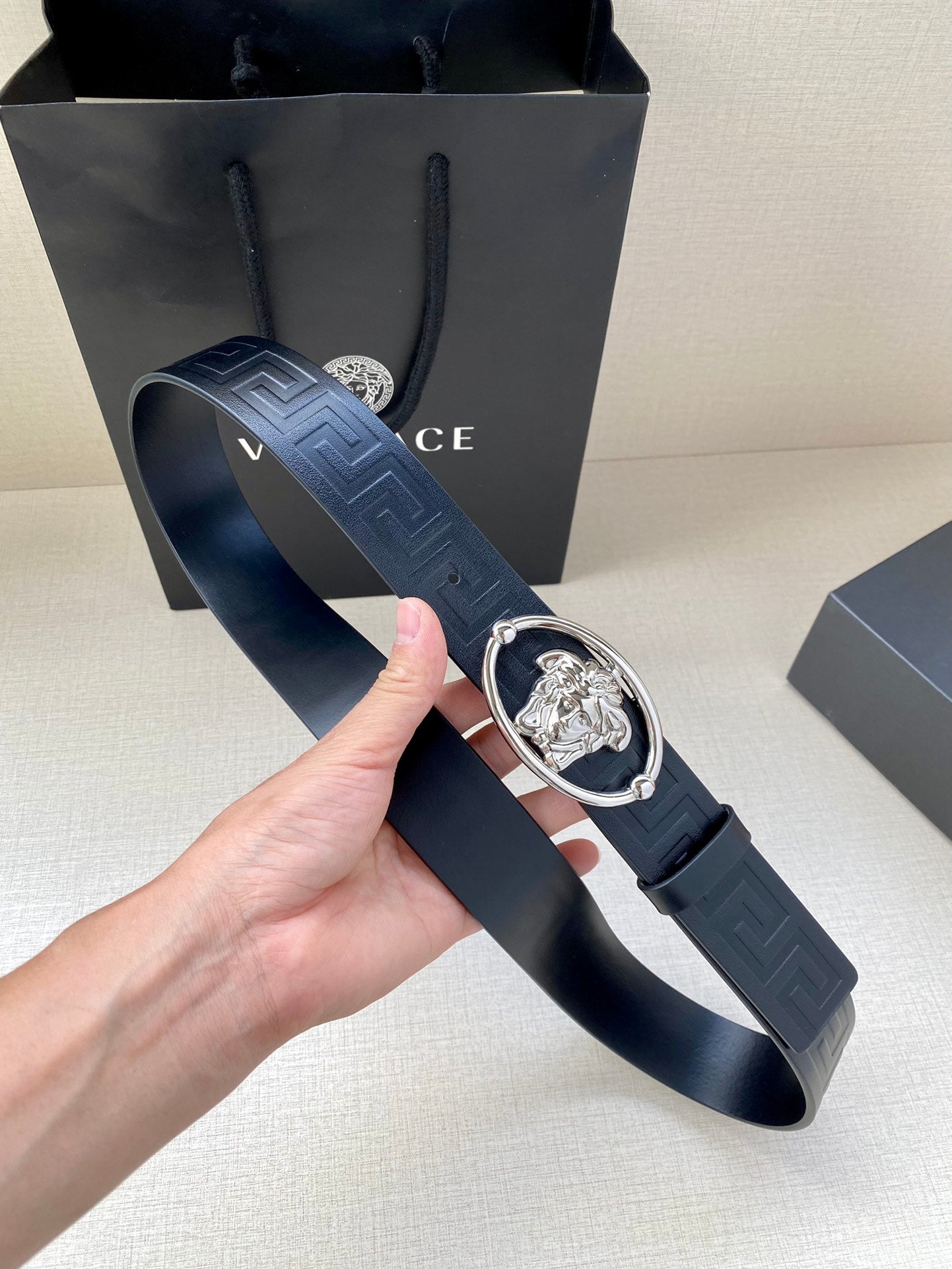 Versace belt with embossed dark navy strap and silver-tone oval Medusa buckle