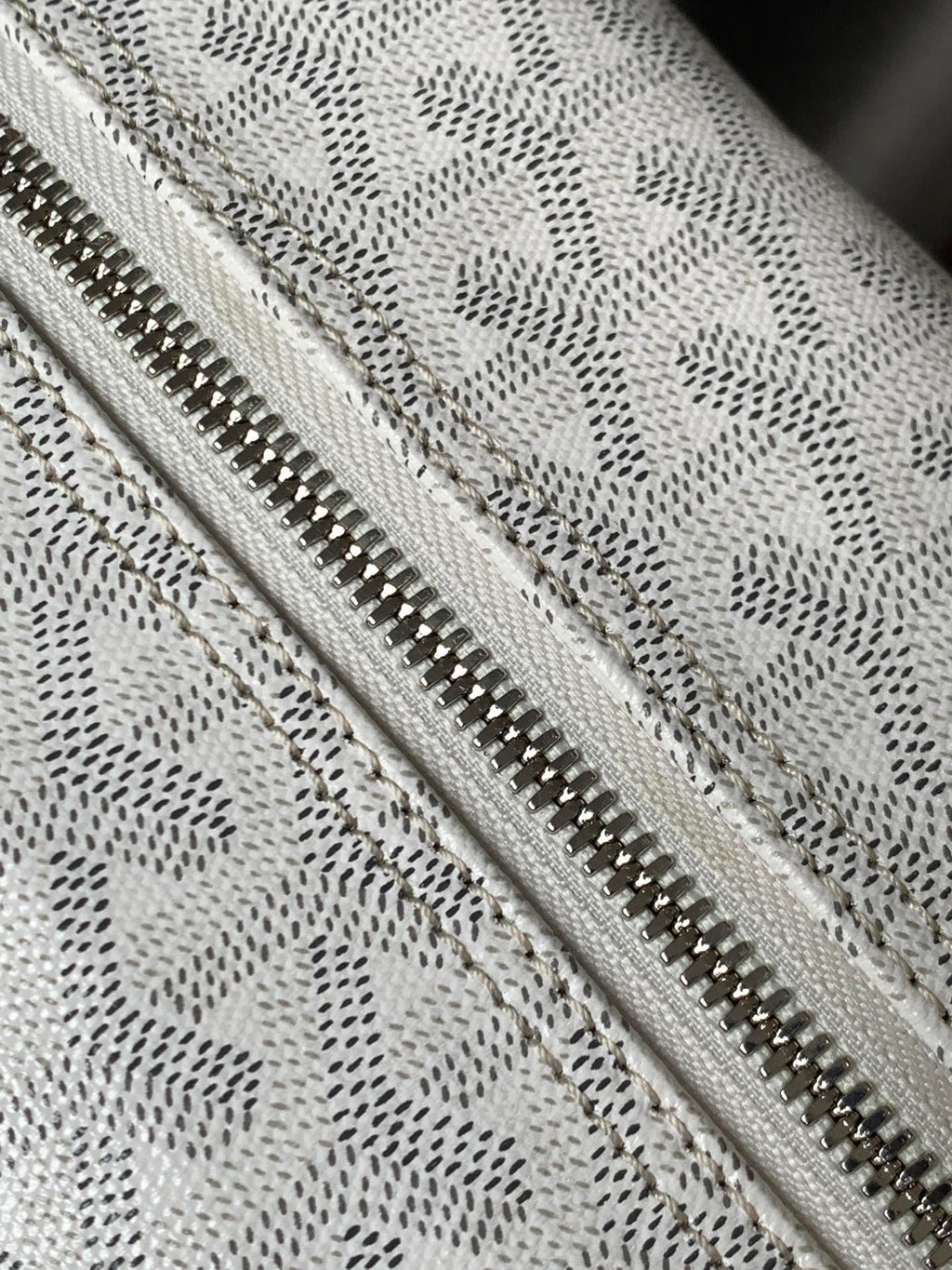 Goyard monogram clutch bag zipper detail with metal teeth and fabric lining