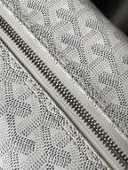 Goyard monogram clutch bag zipper detail with metal teeth and fabric lining