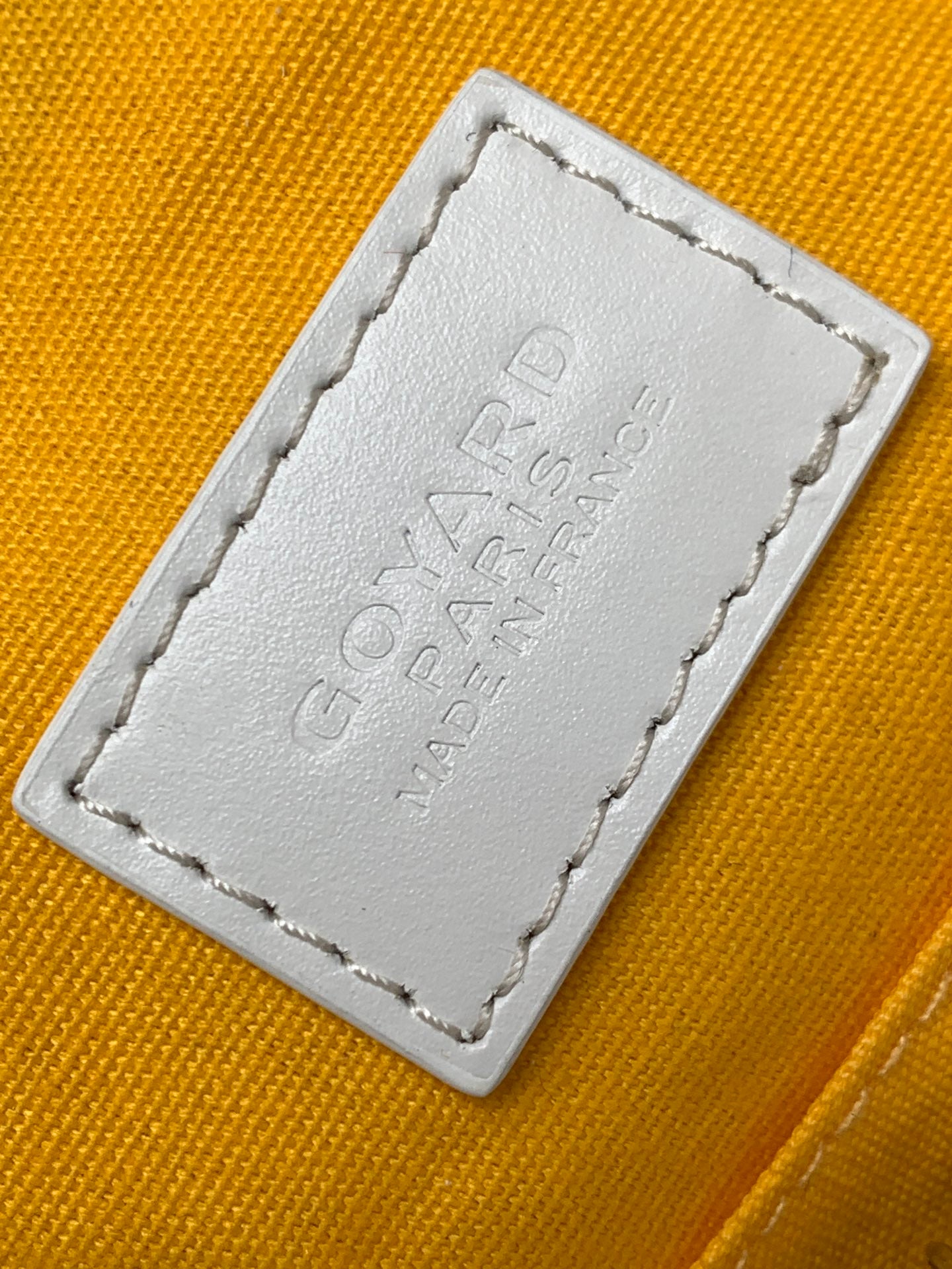 Goyard monogram clutch bag leather logo patch with stitched border