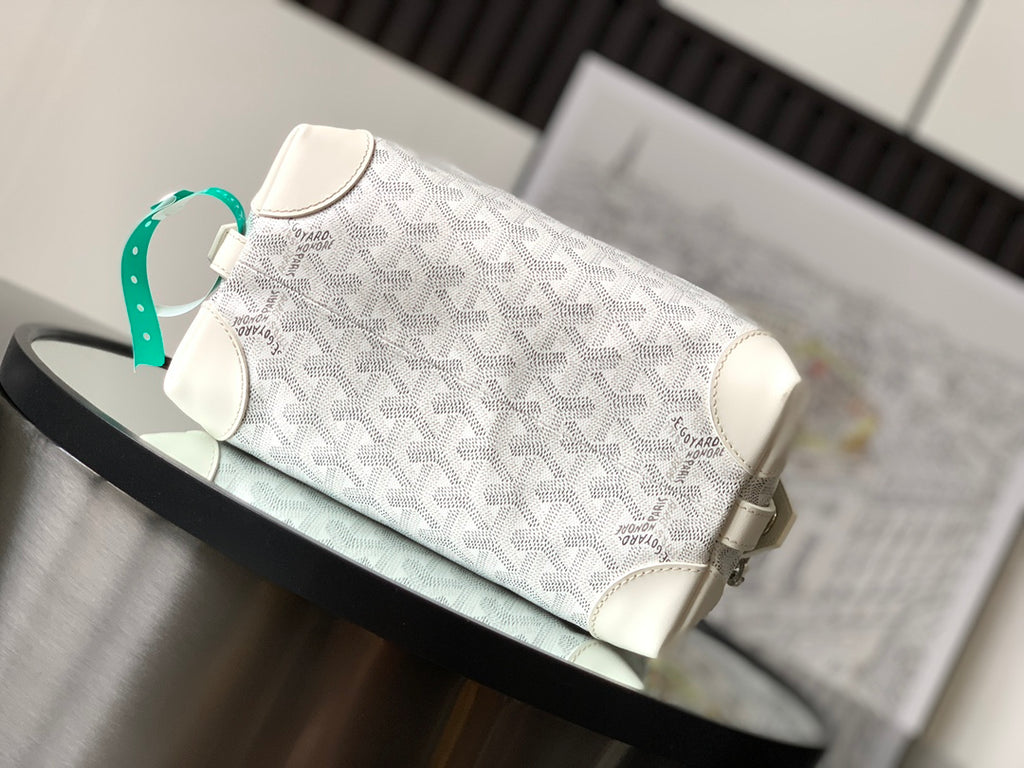 White Goyard monogram clutch bag with shoulder strap and metal side hardware