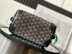 Patterned canvas pouch bag with black leather flap and turquoise-green strap detail