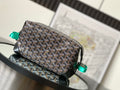 Goyard bag with brown and black patterned canvas, black leather trim, top handle