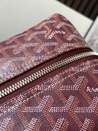 Goyard monogram bag close-up of top zipper and burgundy patterned canvas fabric
