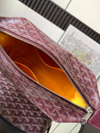 Goyard monogram bag interior with orange lining and zipper opening