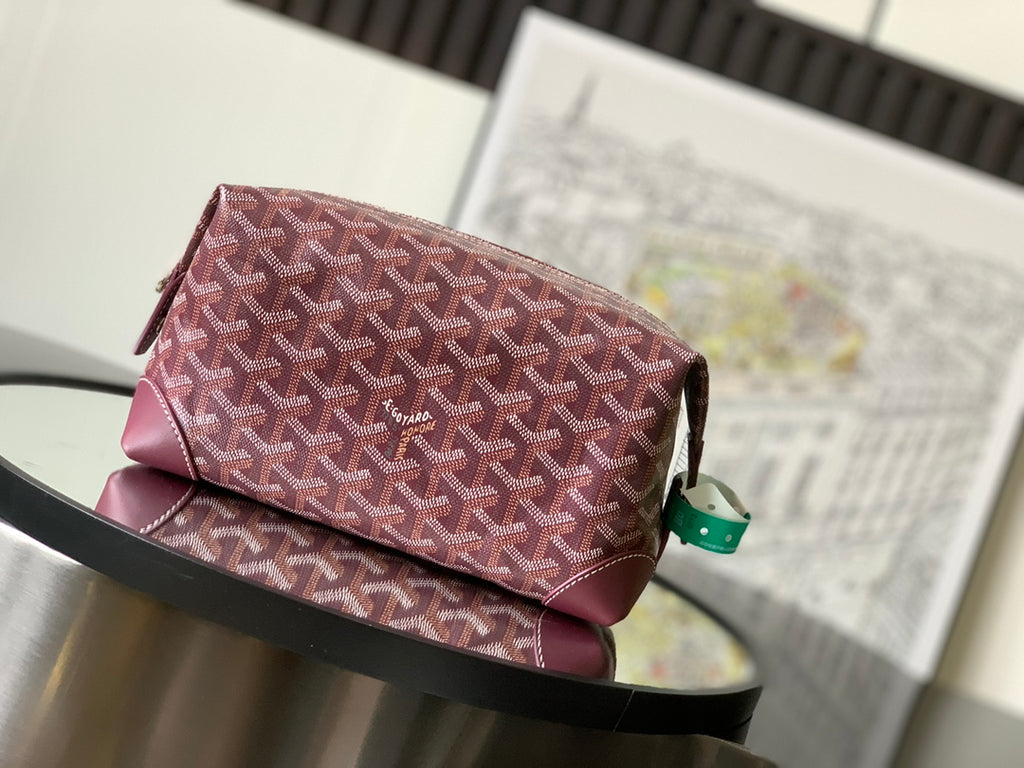 Goyard monogram bag in burgundy patterned canvas with top zip and leather trim