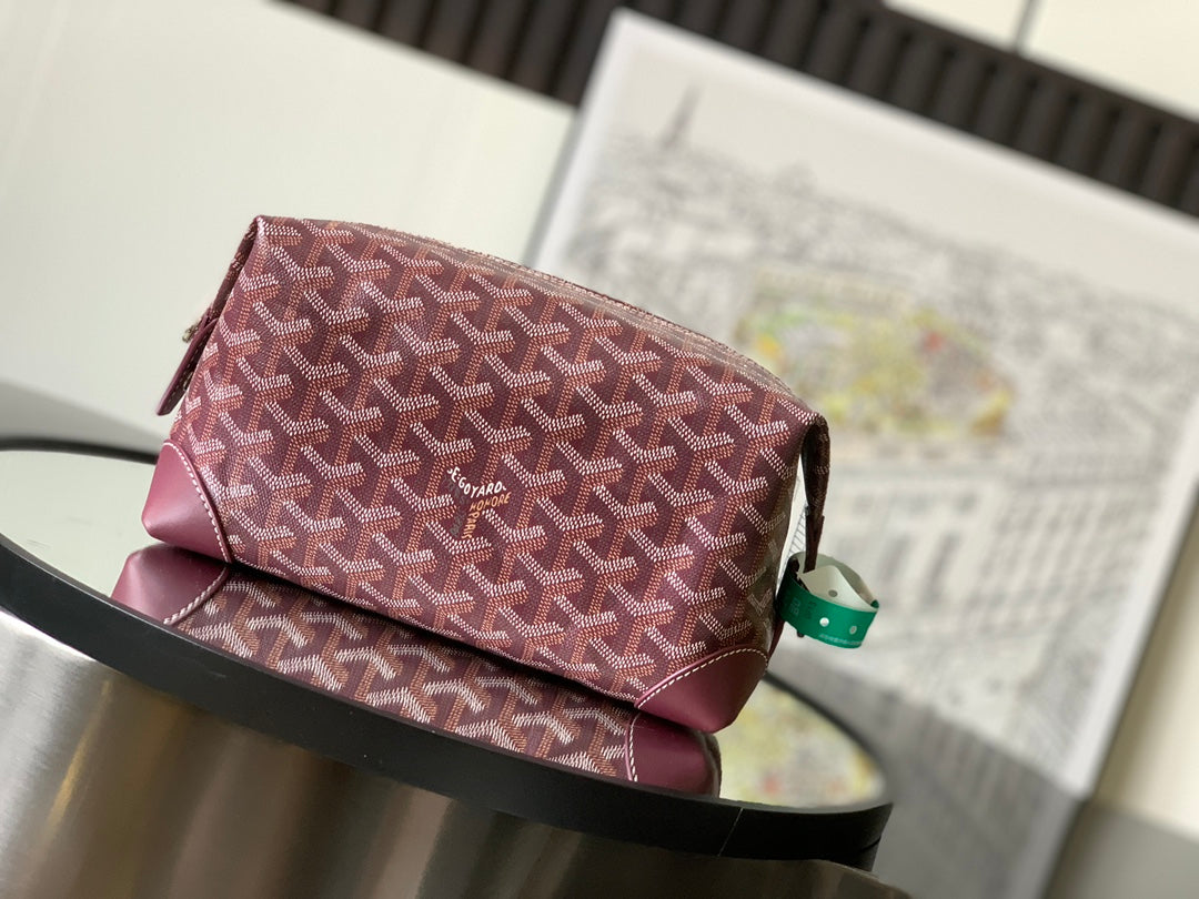 Goyard monogram bag in burgundy patterned canvas with top zip and leather trim