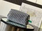 Goyard patterned crossbody bag in dark gray with green leather tag and top zipper