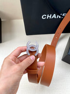 Tan leather belt with CC logo buckle, side view showing belt holes