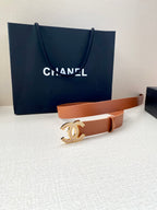 Brown leather belt with gold-tone CC logo buckle, end and strap visible