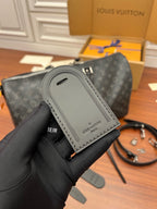 Louis Vuitton monogram duffle bag with attached gray card holder accessory
