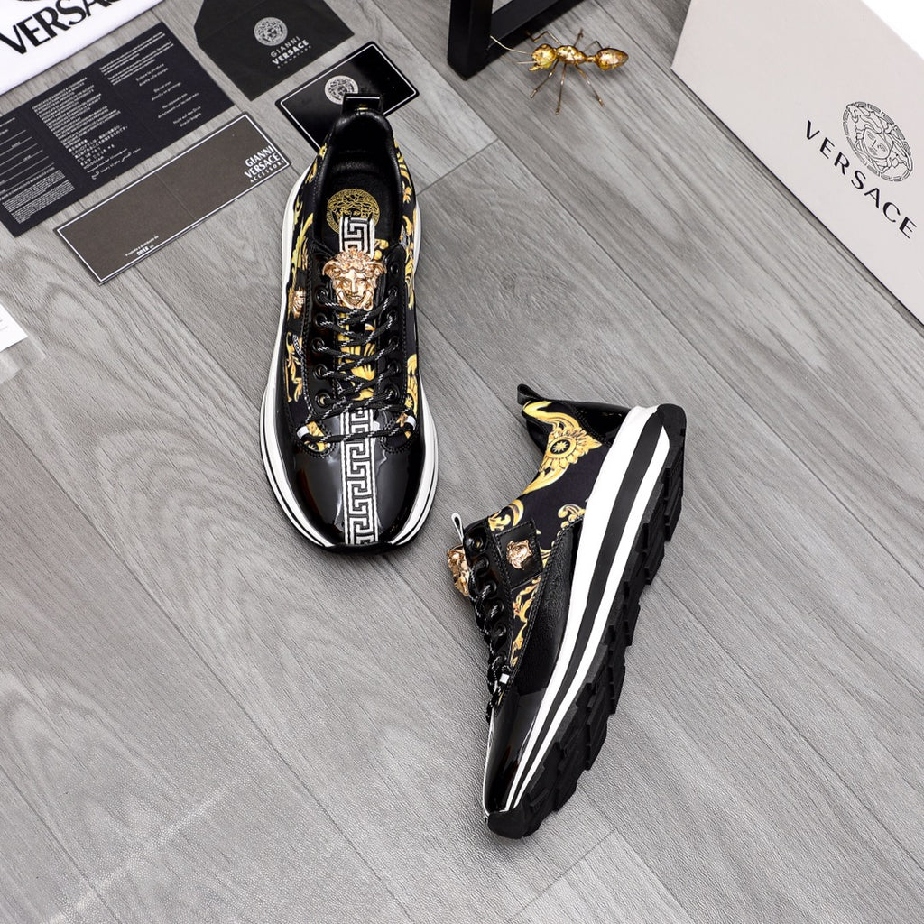 Versace sneakers pair in black with gold baroque print and white rubber soles