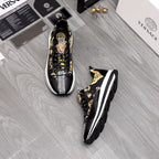 Versace sneakers pair in black with gold baroque print and white rubber soles