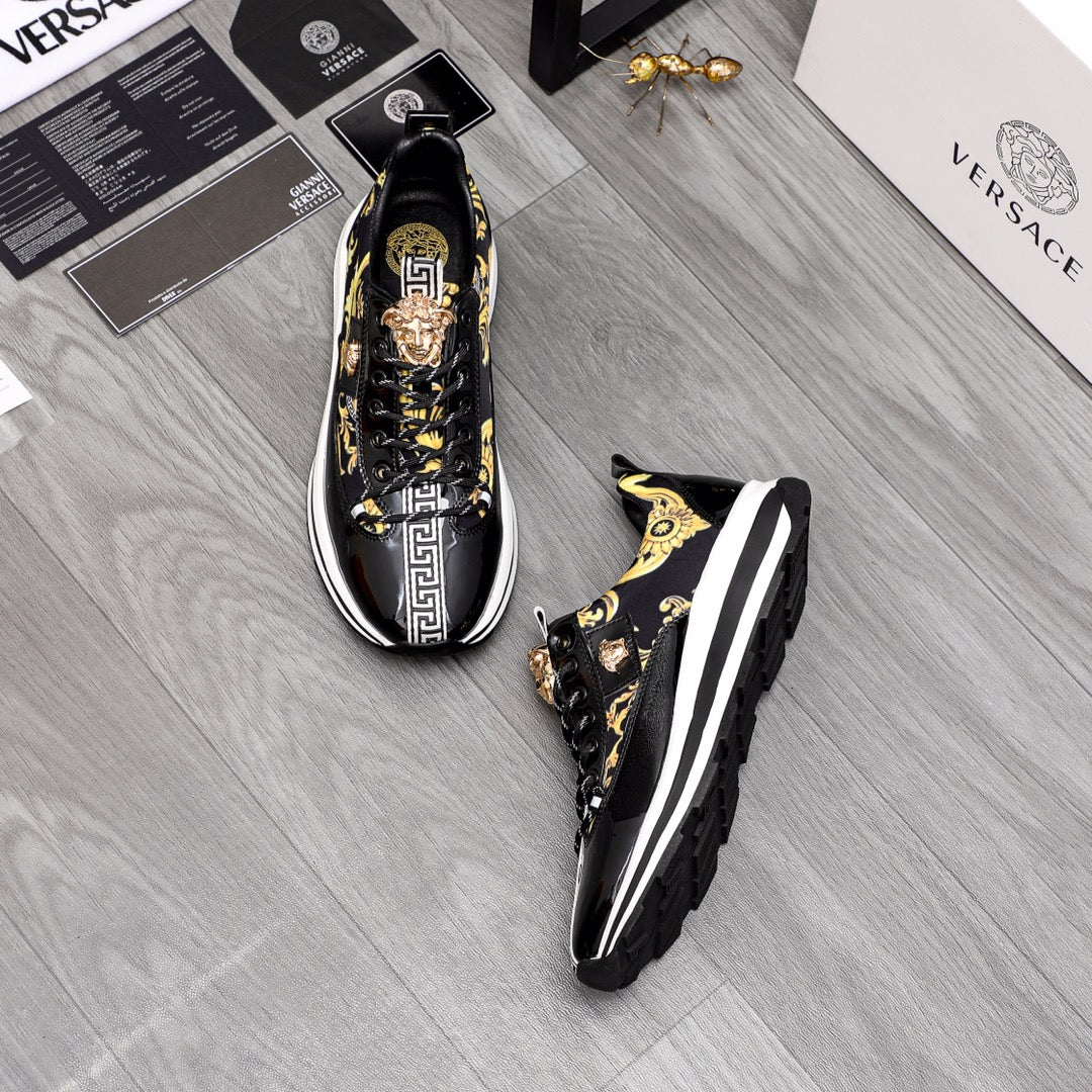 Versace sneakers pair in black with gold baroque print and white rubber soles