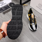 Versace sneakers with textured black rubber outsole and black-and-gold upper