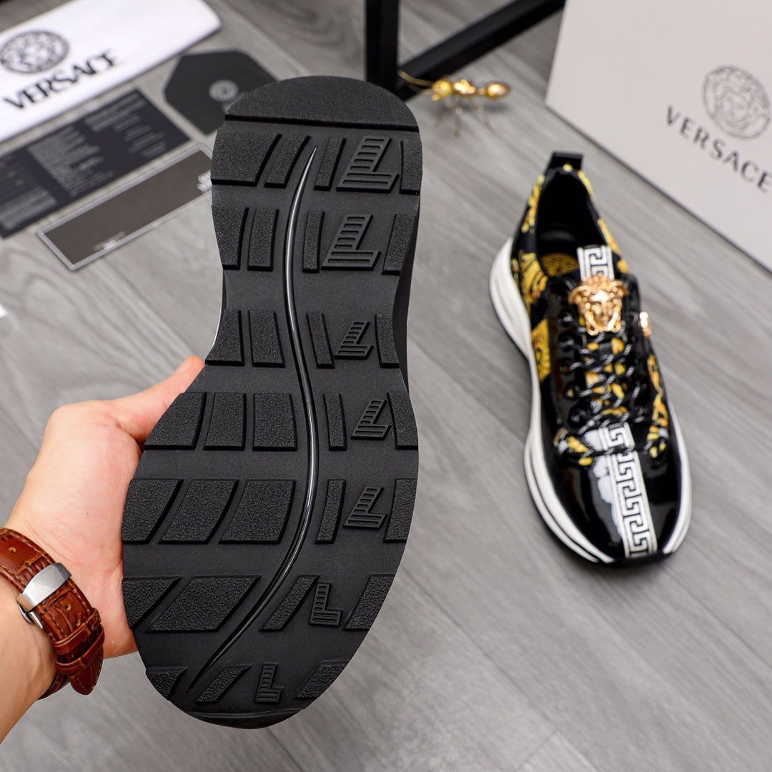 Versace sneakers with textured black rubber outsole and black-and-gold upper