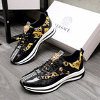 Versace black sneakers with gold baroque print, medallion accents, and white soles