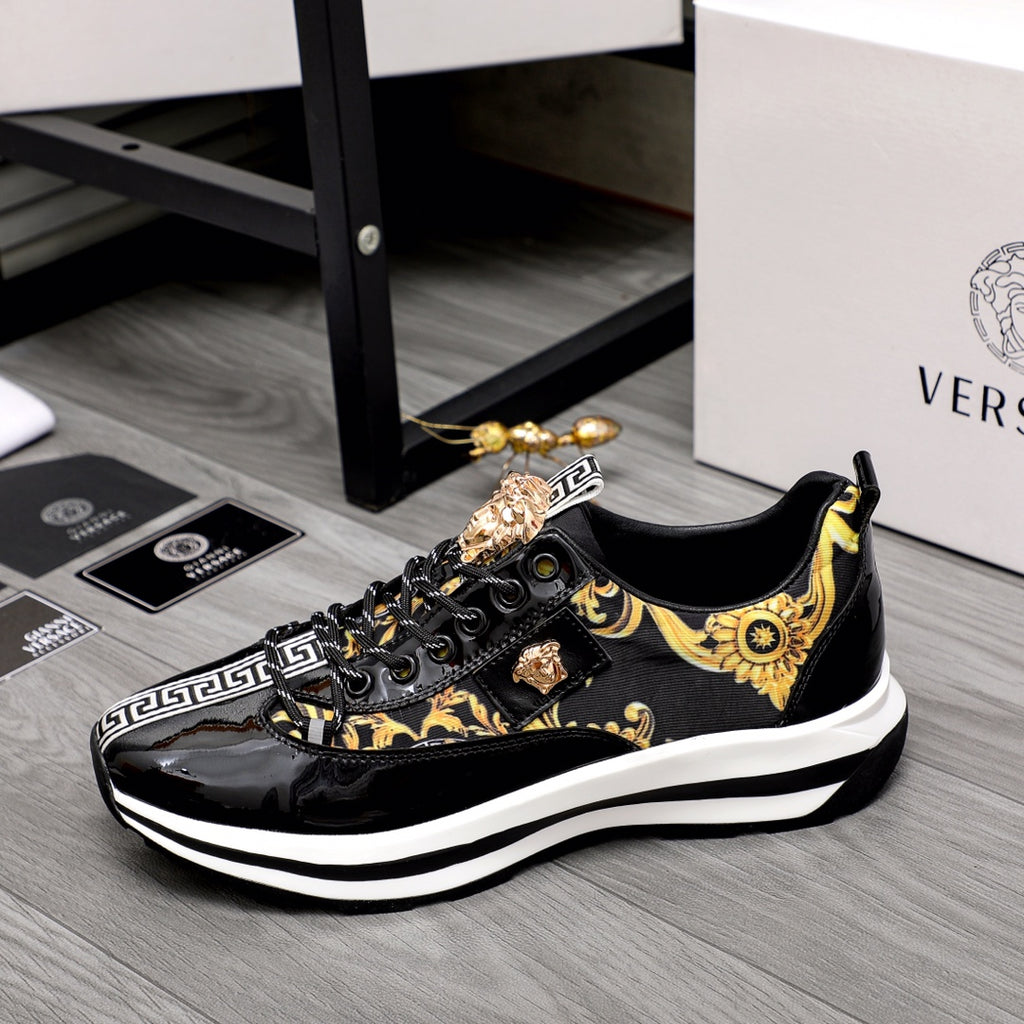 Versace black low-top sneakers with gold baroque pattern and white midsole