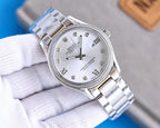 Stainless steel Rolex watch with white dial, Roman numerals, and date window at 3 o'clock.