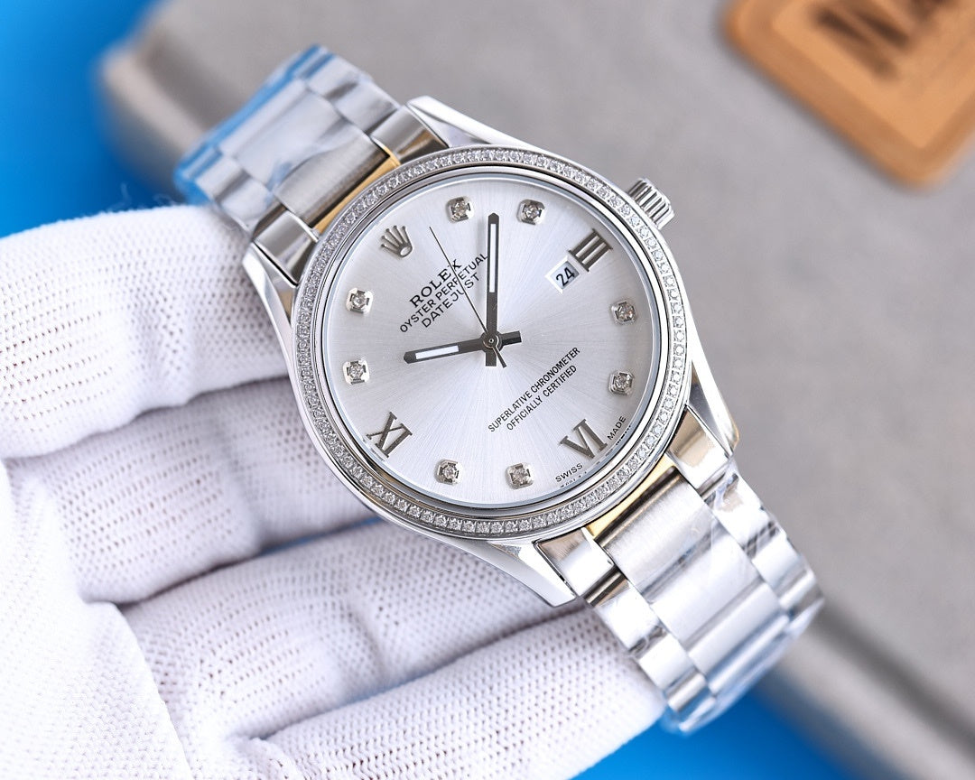 Stainless steel Rolex watch with white dial, Roman numerals, and date window at 3 o'clock.