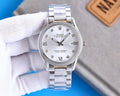 Stainless steel Rolex watch with white dial, Roman numerals, date window at 3 o'clock.