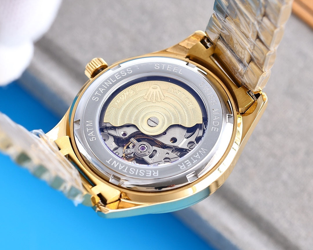 Rolex wristwatch caseback with exposed movement, stainless-steel and gold-tone trim