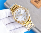 Rolex wristwatch with gold-tone bracelet and light gold dial, roman numerals and gold hands
