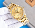 Rolex wristwatch with gold-tone bracelet and light gold dial, roman numerals