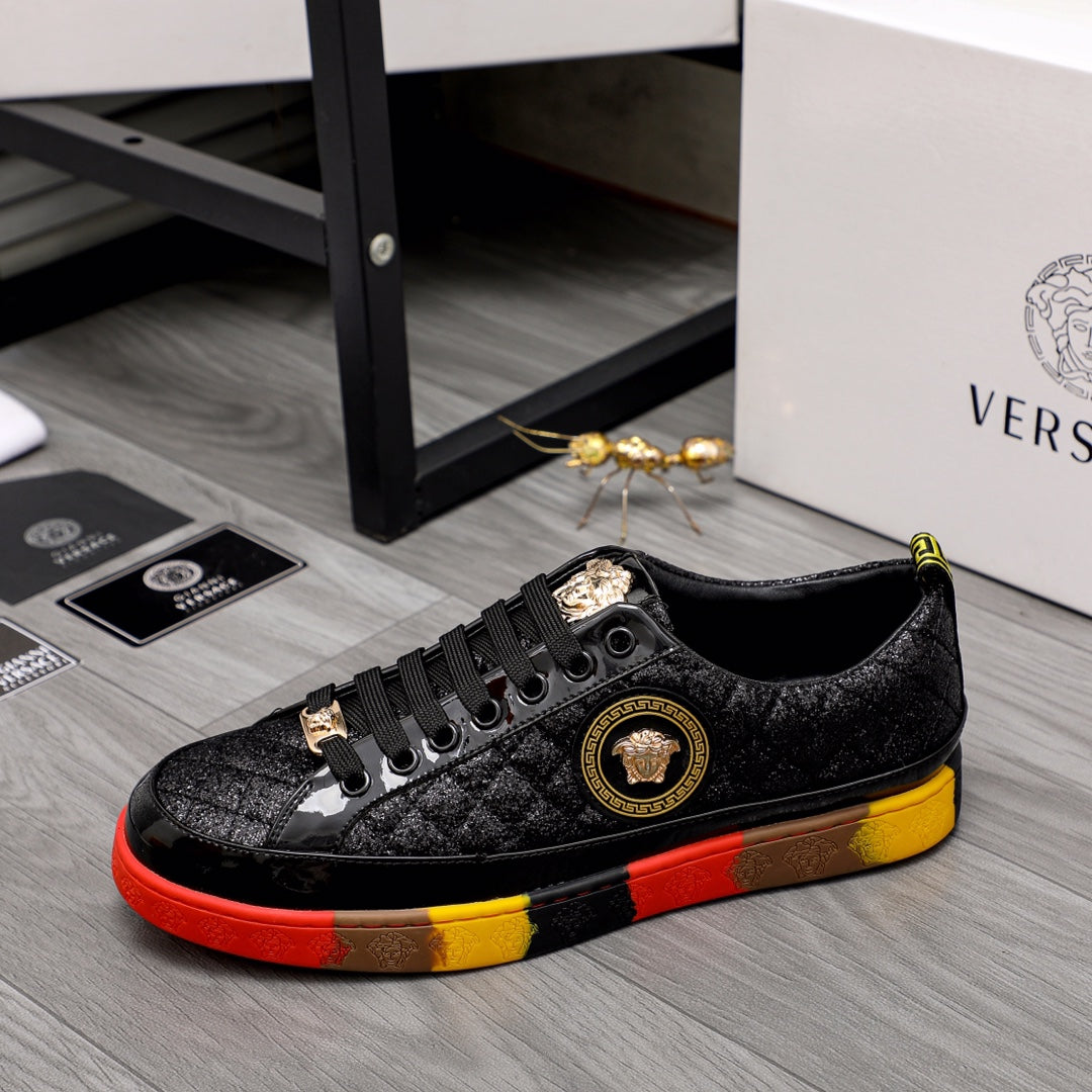 Black lace-up sneakers with gold crest logo on the side and red/yellow outsole