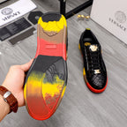 Sneaker heel with multicolor red/yellow sole panel and black upper detail