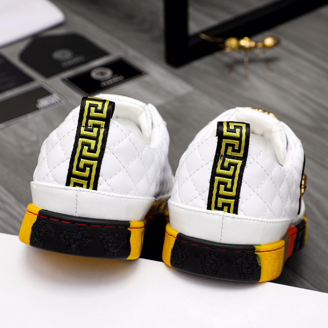 White quilted sneakers with Greek-style trim on heel and red-yellow rubber sole