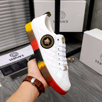 White quilted high-top sneakers with gold side emblem, gold lace charm, red-yellow sole