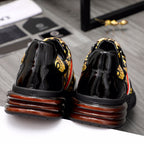 Versace luxury sneakers back view, glossy black uppers with brown-ribbed sole details.