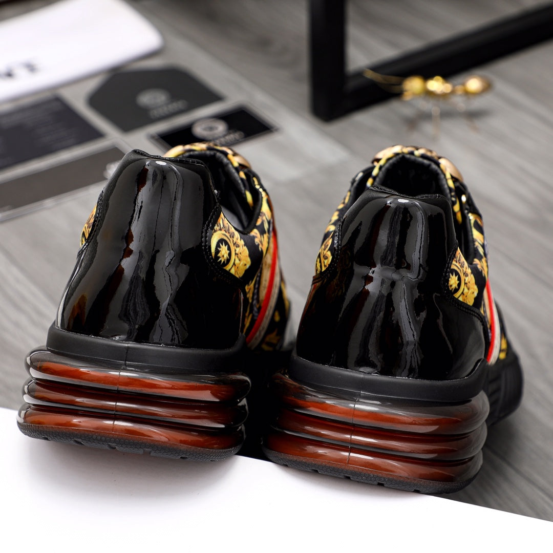 Versace luxury sneakers back view, glossy black uppers with brown-ribbed sole details.