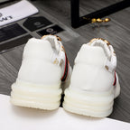 Versace white sneakers with gold crest heel detail and cushioned platform sole